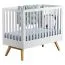 Babybett / Gitterbett Naema 02, Farbe: Weiß / Eiche - Liegefläche: 70 x 140 cm (B x L)